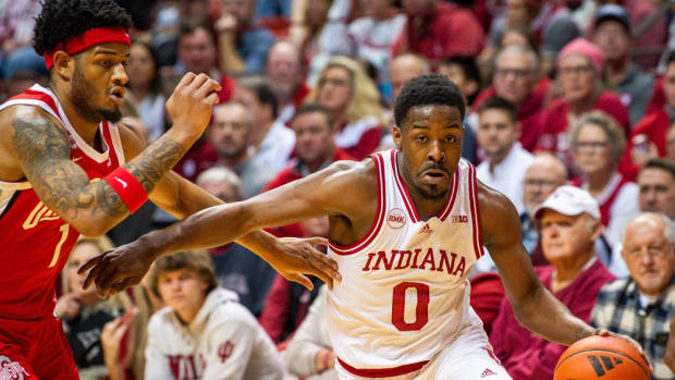 Indiana's Xavier Johnson (0) drives past Ohio State's Roddy Gayle Jr. (1) during the Indiana versus Ohio State men's basketball game.